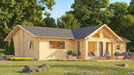 Front-angle view shows the GardenHouse24 USA Francesca 70 Garden Room with a wide deck, lounge chairs, potted plants, and vibrant landscaping