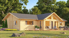 Front-angle view shows the GardenHouse24 USA Francesca 70 Garden Room with a wide deck, lounge chairs, potted plants, and vibrant landscaping
