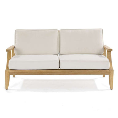 Front-facing view of Westminster Teak Laguna Sofa shows two thick seat cushions and two back cushions resting on the teak frame