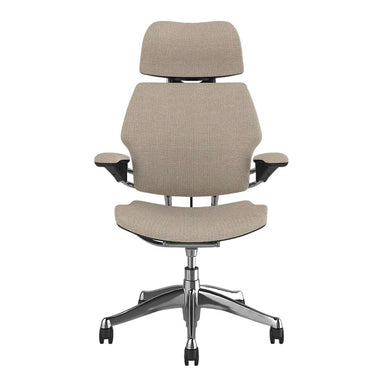 Front view of Crate & Barrel Humanscale® Freedom Headrest Natural Linen Office Chair with natural linen upholstery, headrest, padded arms, and chrome base