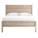 Front view of Crate & Barrel Keane Weathered Natural Solid Wood Queen Bed featuring a paneled headboard, matching footboard, and white bedding