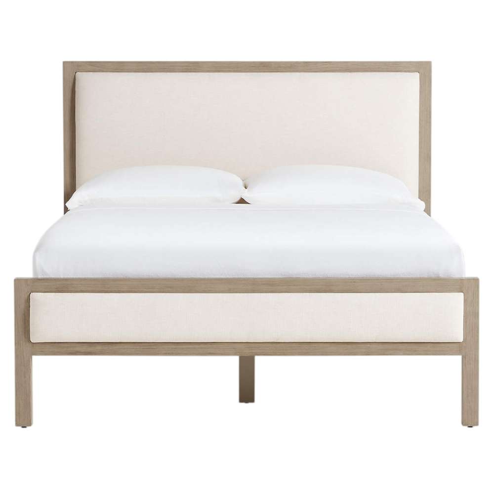 Front view of Crate & Barrel Keane Weathered Natural Wood Upholstered Queen Bed with cream upholstered panels and a weathered natural wood frame