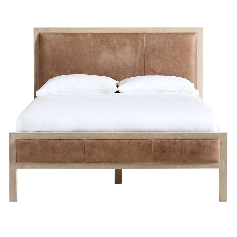 Front view of Crate & Barrel Keane Weathered Natural Wood and Leather Queen Bed with brown leather panels framed by weathered natural wood