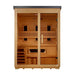 Front view of Golden Designs Carinthia 3 Person Hybrid Flat Roof Outdoor Sauna showing a black flat roof, hemlock frame, glass front, carbon panels and a guarded stove