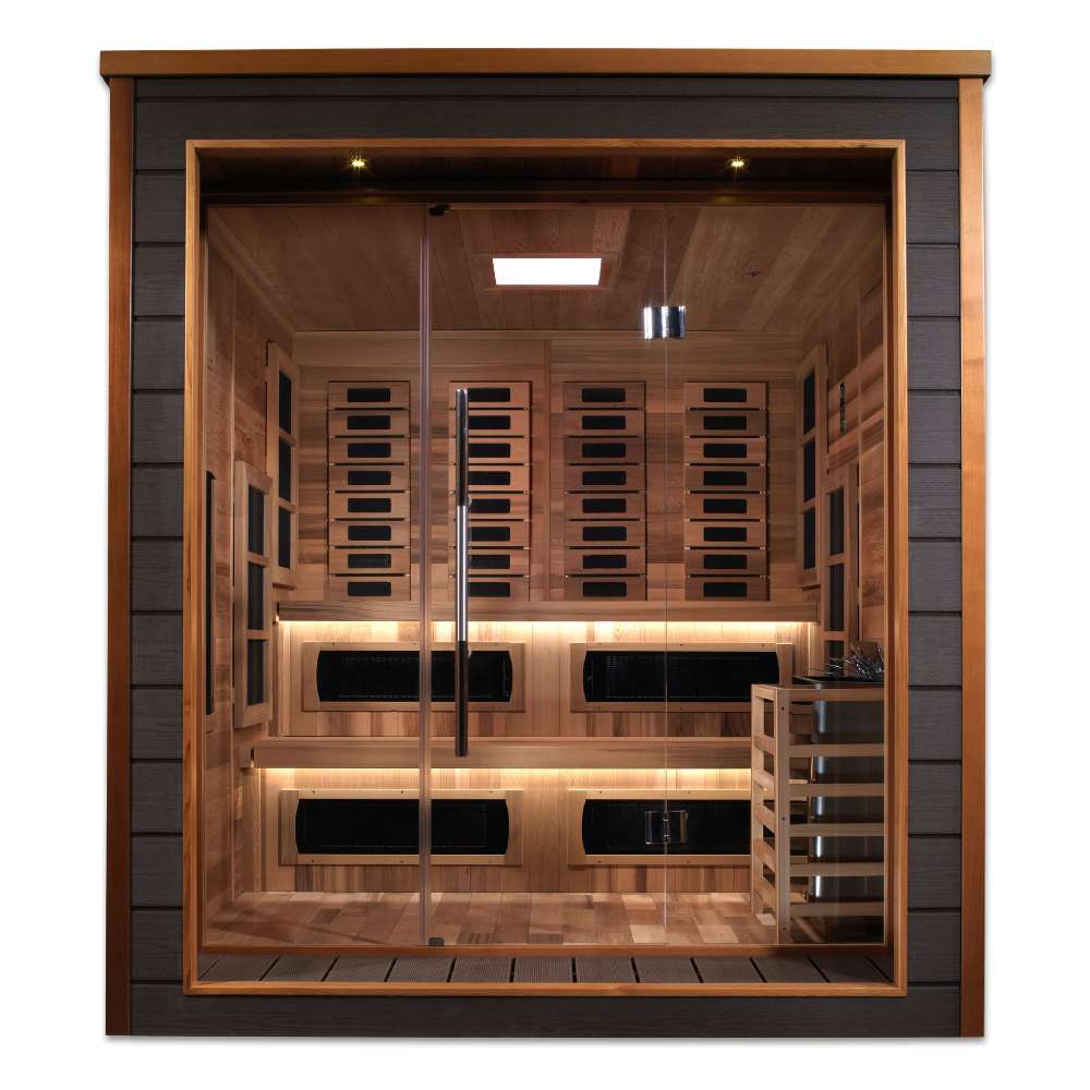 Front view of Golden Designs Karlstad 6 Person Outdoor-Indoor PureTech Hybrid Full Spectrum Sauna showing a dark exterior, wide glass front, carbon panels and two lit cedar benches