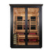 Front view of Golden Designs Kaskinen 6 Person 2 Tone Barn Hybrid Outdoor Sauna showing a black frame, double glass doors and a cedar interior with infrared heaters