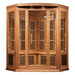 Front view of Golden Designs Maxxus Avignon 3 Person Corner Near Zero EMF Far Infrared Sauna in Red Cedar showing its angled corner cabin, clear glass door and roof accent lights