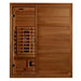 Front view of Golden Designs Maxxus S-Line 3 Person Full Spectrum Infrared Sauna in Pacific Cedar showing a Pacific cedar cabin, glass door and glowing near infrared heater below the bench
