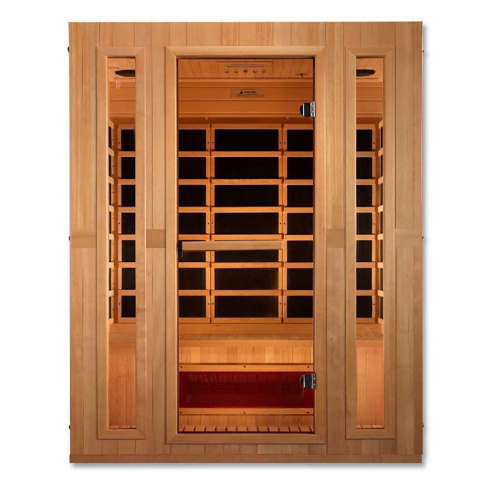 Front view of Golden Designs Maxxus Trinity Dual Tech 3 Person Low EMF Far Infrared Sauna showing a hemlock cabin, clear glass door and a glowing heater below the bench