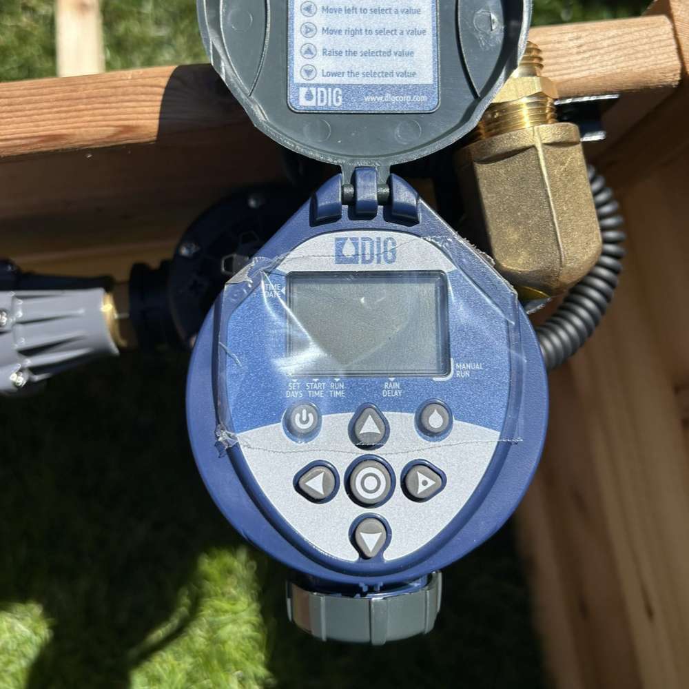 Front view of Outdoor Living Today Raised Garden Bed Auto-Watering System digital timer with control buttons