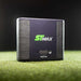 Front view of SKYTRAK ST MAX Launch Monitor standing on green artificial turf against a dark background