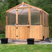 Front view of the greenhouse on grass shows the sturdy 8x8 Outdoor Living Today Western Red Cedar Greenhouse Kit