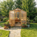 Front view with open doors shows plants and tools inside the 8x12 Outdoor Living Today Western Red Cedar Greenhouse Kit