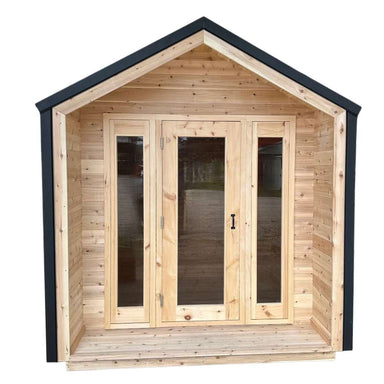 Front view of Sawmill Structures CabinSauna displaying its double glass doors and wooden porch