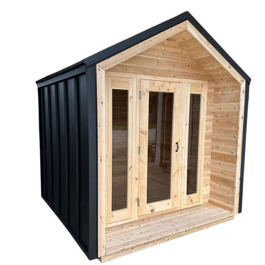 Front view of Sawmill Structures CabinSauna, featuring large glass doors framed in natural wood