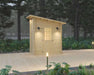 Front view of Sawmill Structures Loo Loo House Garden Room reveals a warm-lit wooden door and elegant black sconces on each side