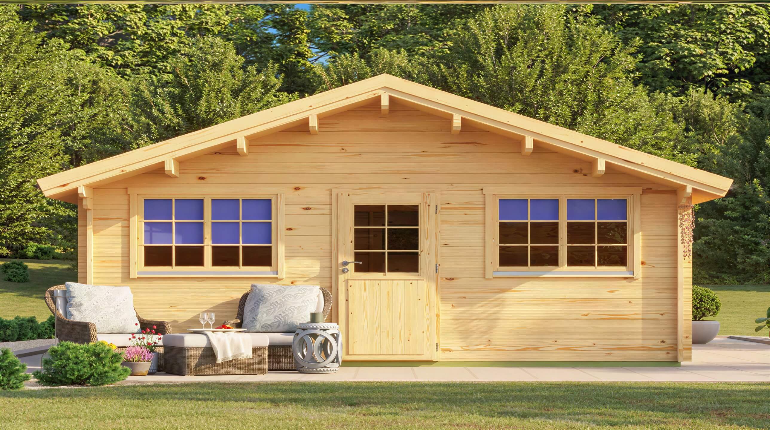 Frontal view of the GardenHouse24 USA Sean 44 Garden Room showcases its symmetrical wooden façade with two sets of double windows, a central door, and outdoor seating on a sunny lawn