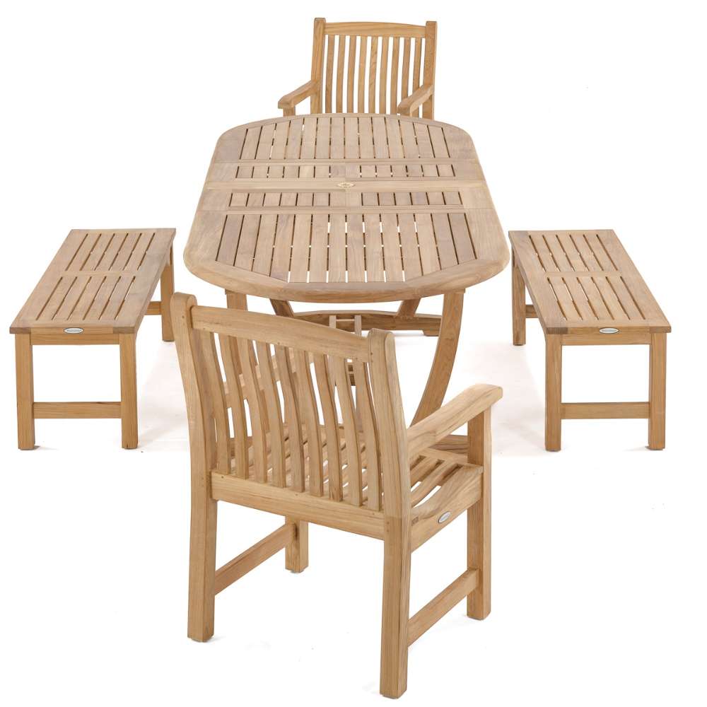 Full outdoor dining arrangement features multiple Westminster Teak Veranda Teak Armchairs around a matching table with benches on a white background