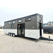 Full side view of Sawmill Structures Wanderlove Tiny Home shows its triple-axle base, black top siding, and stone-textured bottom half