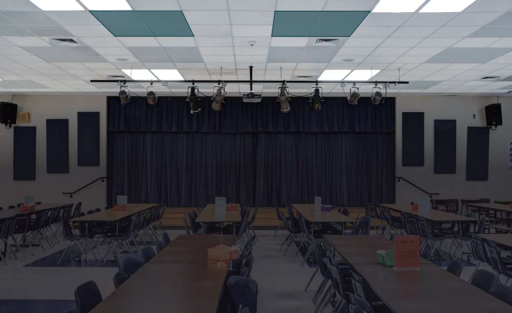 GIK Acoustics Ceiling Acoustic Panel installed in a school cafeteria ceiling helps reduce echo and improve sound clarity in the large dining space