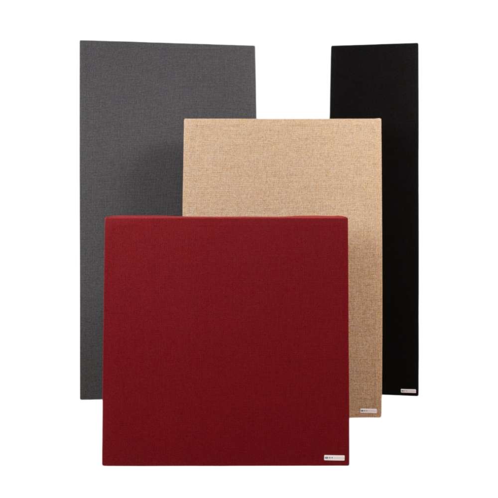 GIK Acoustics Classic Bass Trap acoustic panels displayed in gray, beige, black, and red fabric finishes, standing upright against a light background