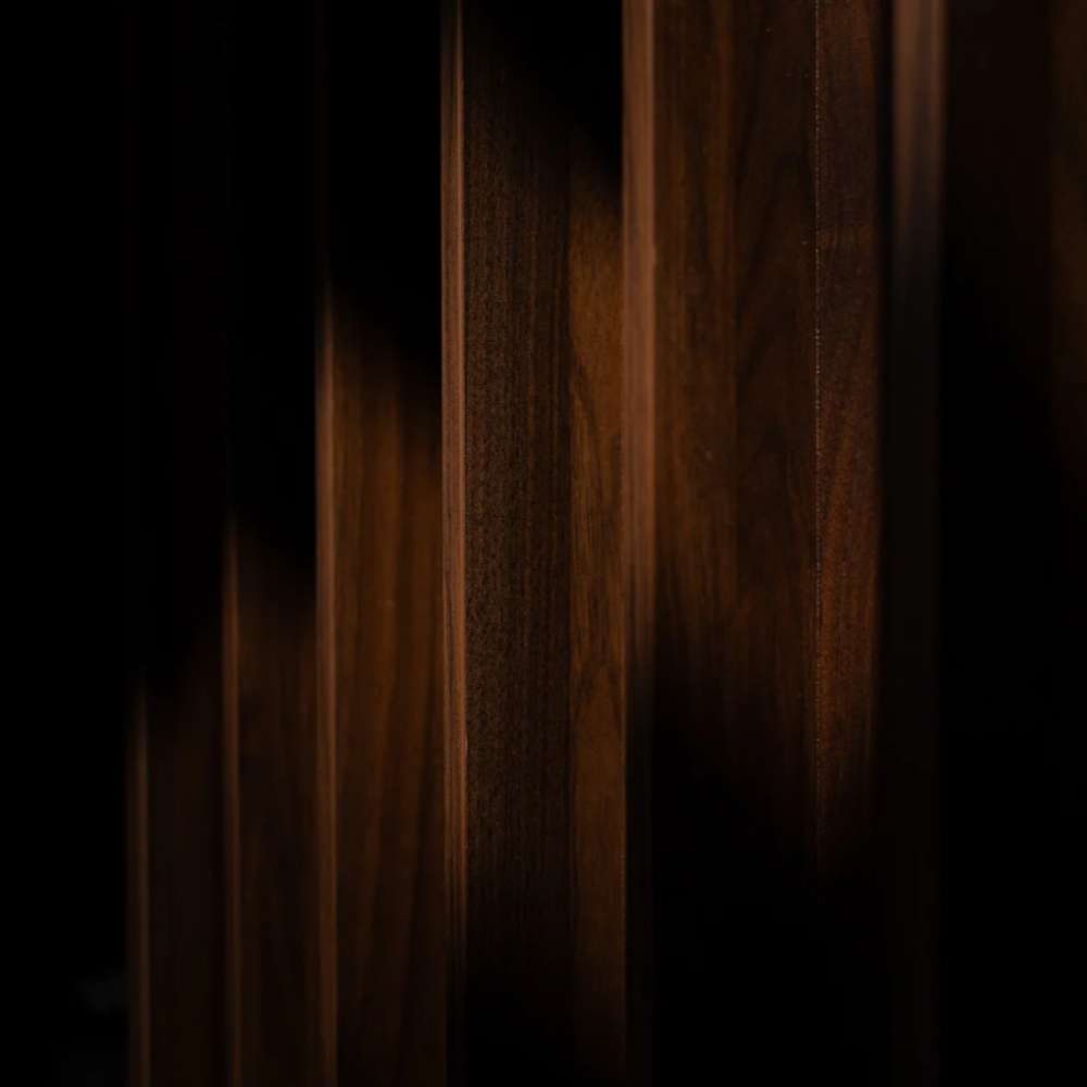 GIK Acoustics Q11D Quadratic Residue Diffuser detailed view of walnut wood diffuser wells, highlighting the natural grain and deep vertical channels