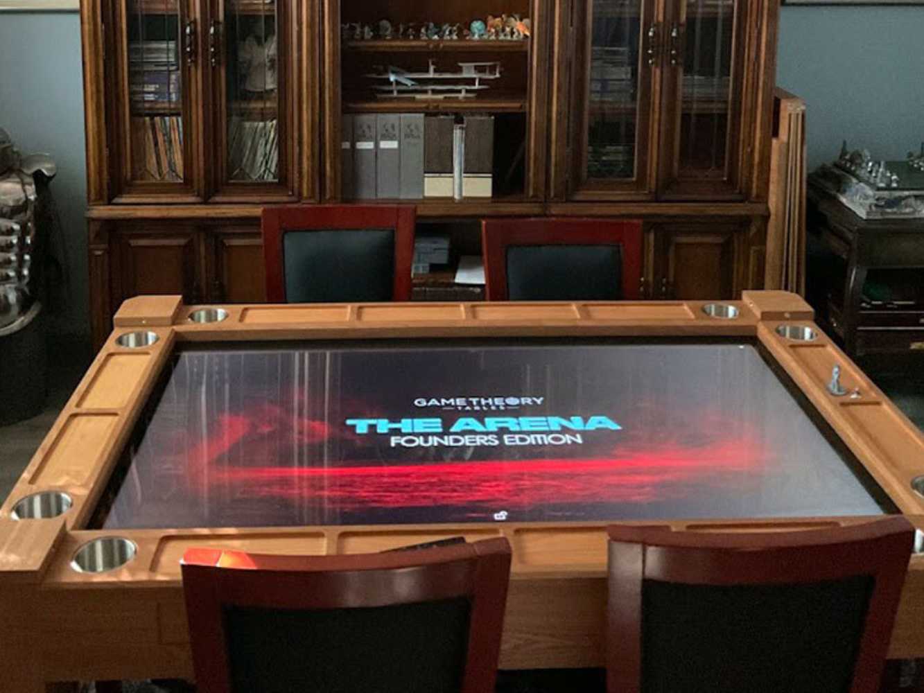 Game Theory Tables The Arena Founders Edition displays a sleek digital screen with the product name in bold