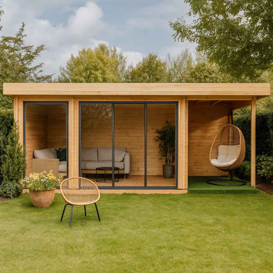 GardenHouse24 USA ALU Concept 44O Garden Room appears as a cozy garden retreat with sliding glass doors, a sofa set inside, and a wicker egg chair on the patio