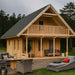GardenHouse24 USA Anders 90A Garden Room is displayed with stylish outdoor furniture on a cloudy day