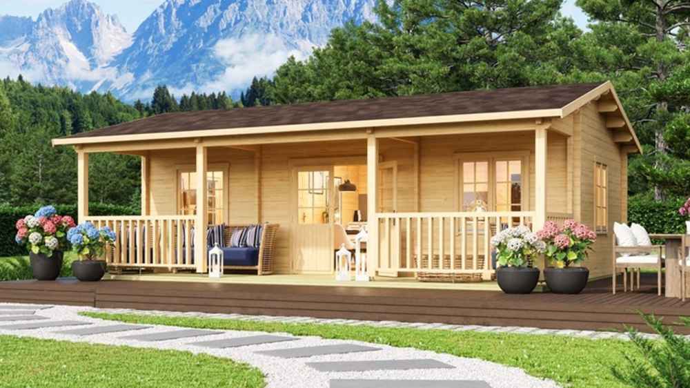 GardenHouse24 USA Barrit 70 Garden Room with a spacious front porch surrounded by potted flowers and mountains in the background