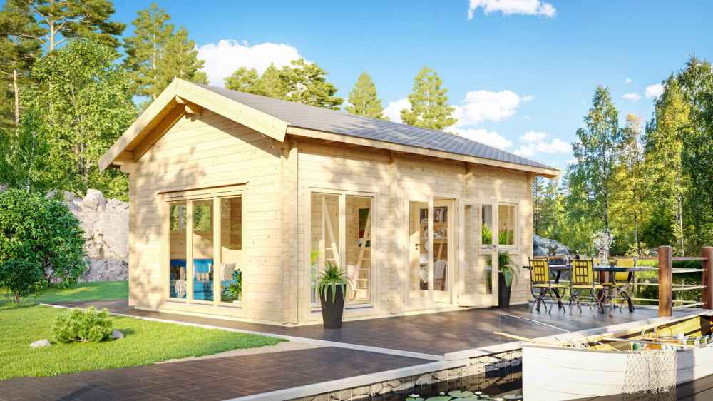 GardenHouse24 USA Britt 44 Garden Room is shown in a vibrant lakeside setting with a deck, outdoor furniture, and bright sun