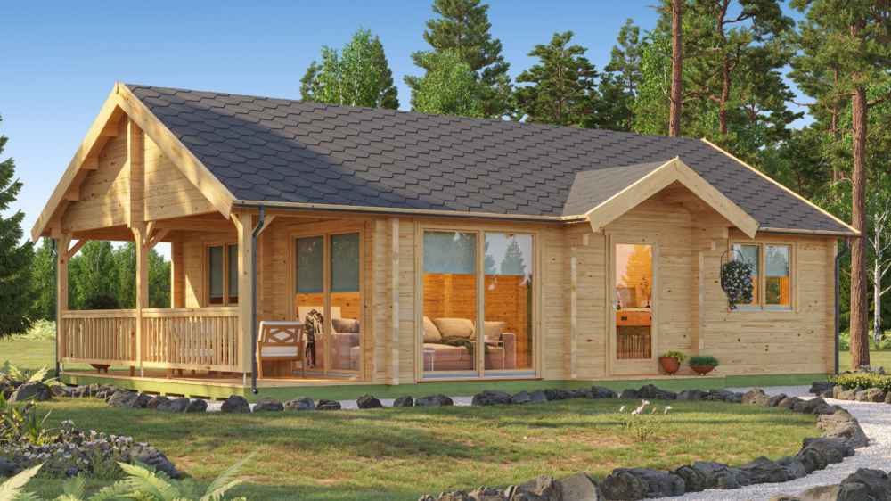 GardenHouse24 USA Garda 90 Garden Room stands surrounded by trees, its natural wood exterior glowing in daylight with a cozy patio on the left