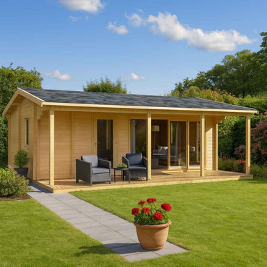 GardenHouse24 USA Mikka 70 Garden Room with a front porch and dark furniture sits in a sunny, green backyard