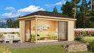 GardenHouse24 USA Pavilion ALU 44C Garden Room is pictured in a landscaped backyard, fully furnished with green-cushioned seating and surrounded by flowers and trees