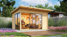 GardenHouse24 USA Starla 44A ALU Garden Room is pictured in a landscaped backyard setup, used as an office space with visible desk, flowers, and artwork inside