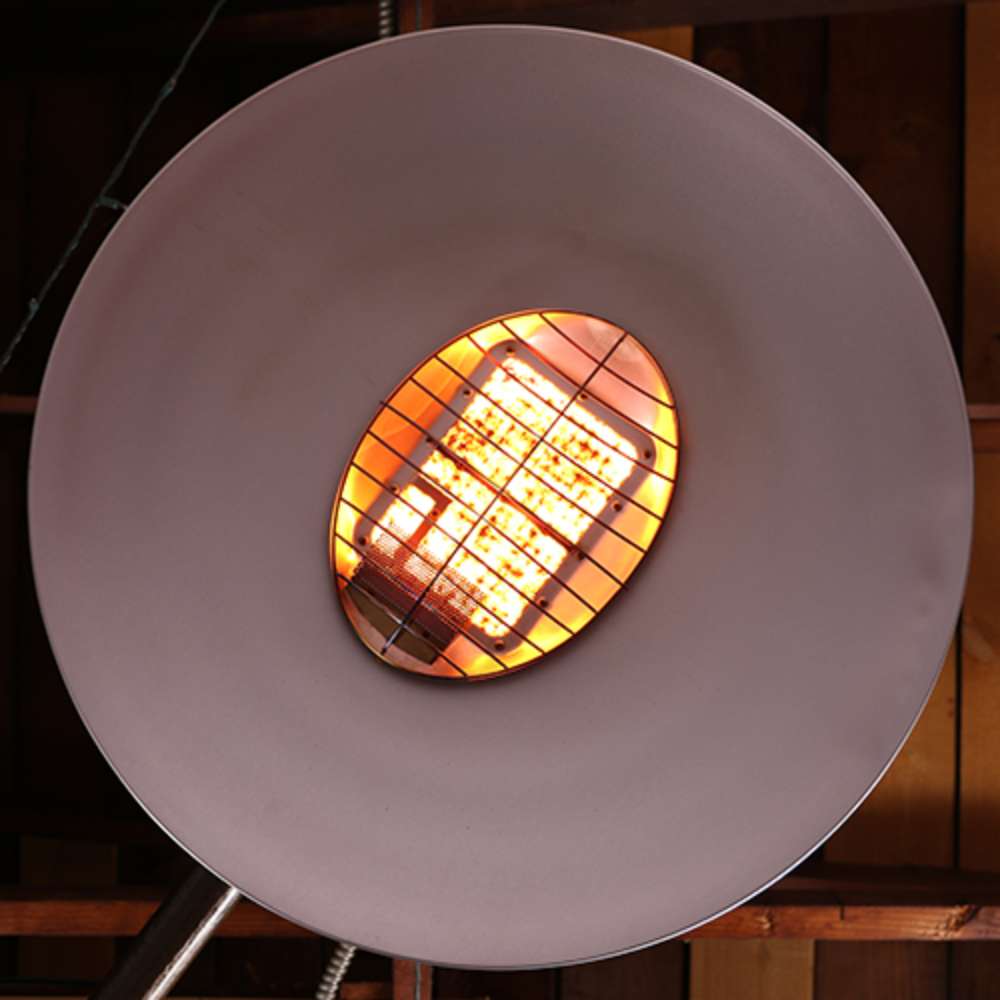 Glowing heating element and large circular reflector are shown up close on the Outdoor Order Curve Infrared Heater