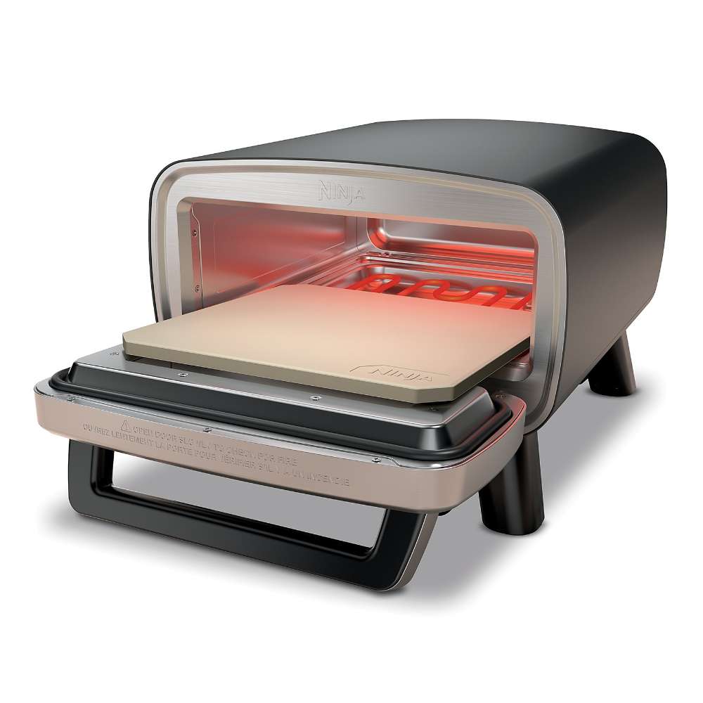 Glowing heating elements surround the empty pizza stone inside the open Ninja Artisan 5-in-1 Portable Electric Pizza & Outdoor Oven