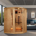 Golden Designs 2025 Reserve Edition 3 Person Full Spectrum Sauna with Himalayan Salt Bar stands in the corner of a modern living room beside a blue sofa and framed art