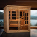 Golden Designs 6 Person Near Zero EMF Far IR Sauna Elite in a room with tall windows overlooking a lake and mountains