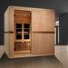 Golden Designs Catalonia 8 Person Near Zero EMF Far IR Sauna stands in a dark modern room with a large window behind it