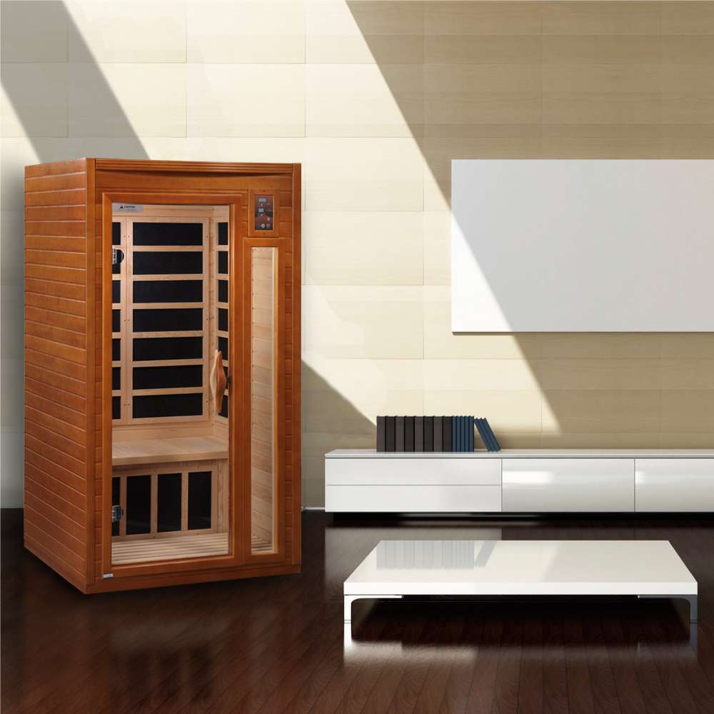 Golden Designs Dynamic Barcelona 1-2 Person Low EMF Far Infrared Sauna sits in a bright modern room with white furniture and wide windows