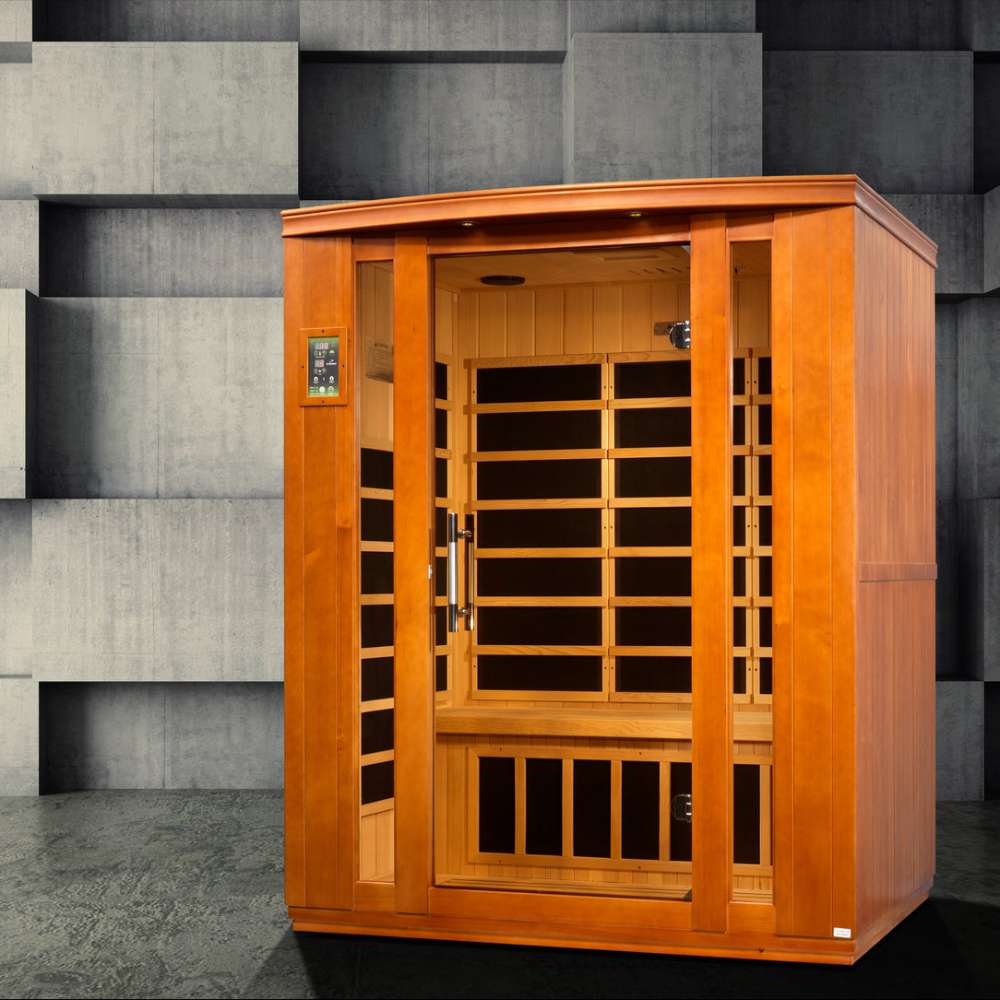 Golden Designs Dynamic Bellagio 3 Person Low EMF Far Infrared Sauna stands in a room with a gray stone block wall and a dark floor