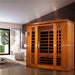 Golden Designs Dynamic Bergamo 4 Person Low EMF Far Infrared Sauna stands in a modern room with wide windows and a light gray floor