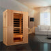 Golden Designs Maxxus Serenity Dual Tech 2 Person Low EMF Far Infrared Sauna stands in a living room with a white sofa, floor lamp and dark wood floor