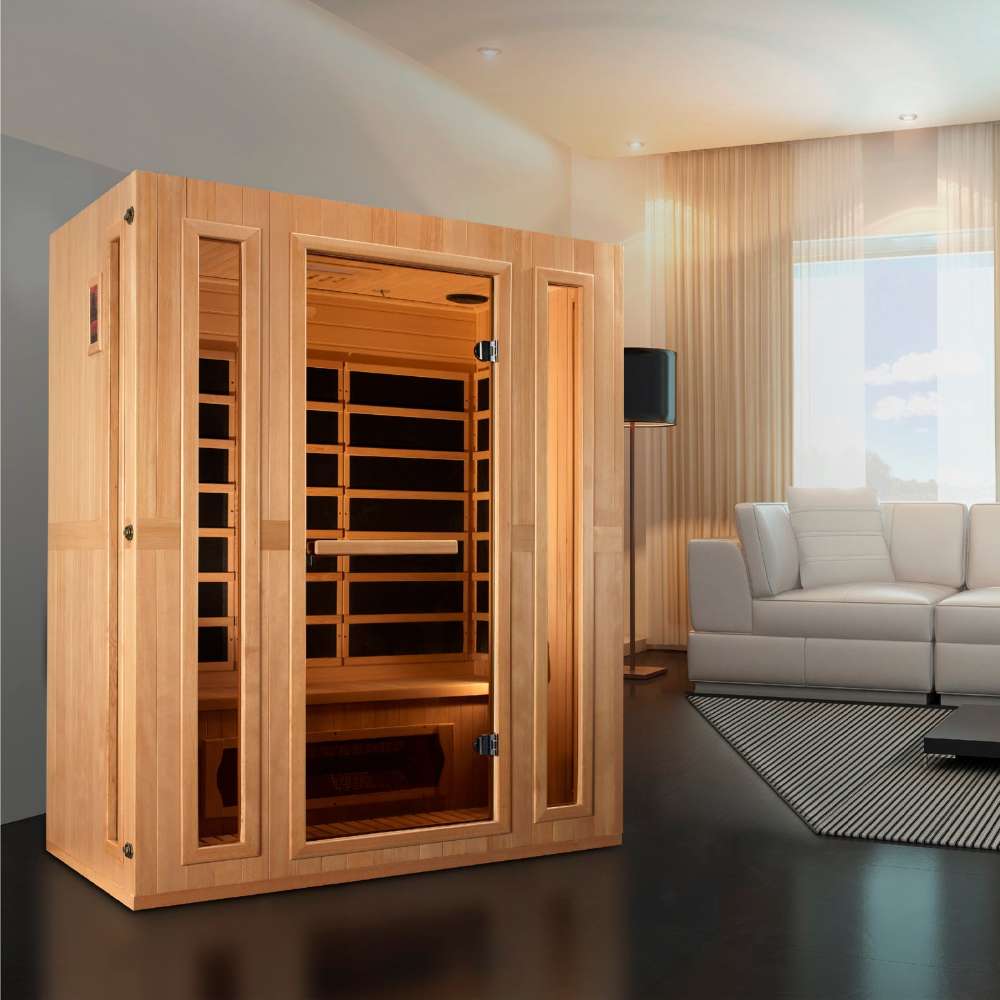 Golden Designs Maxxus Trinity Dual Tech 3 Person Low EMF Far Infrared Sauna stands in a living room with a white sofa and dark wood floor
