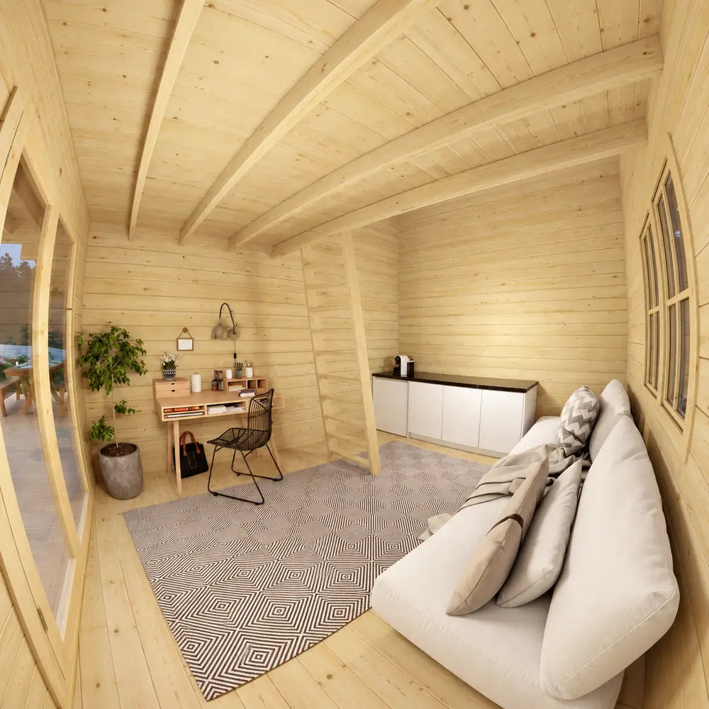 Small home office inside the GrandView 150 with a wooden desk, black chair, potted plants, white storage cabinet and pale pine walls.