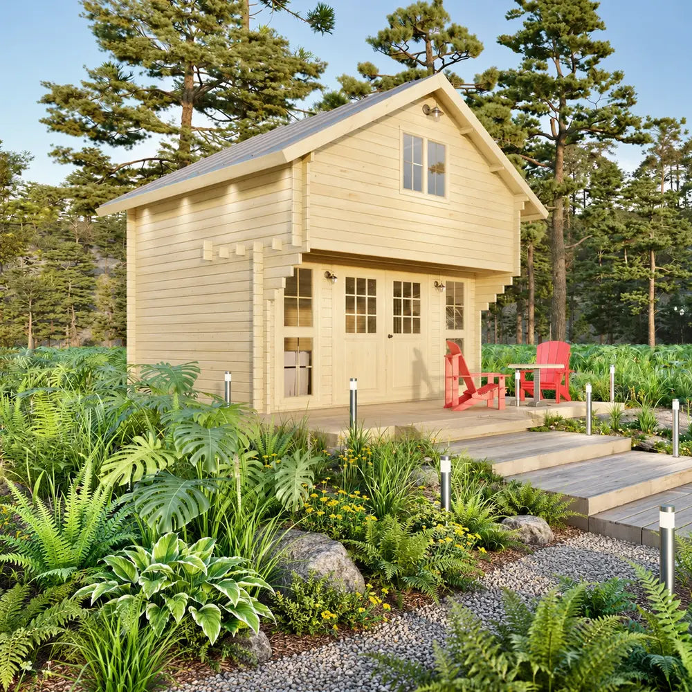 Front view of the Grand Loft 107 Deluxe DD wooden cabin with a steep metal roof, loft window, glazed doors and two red Adirondack chairs.