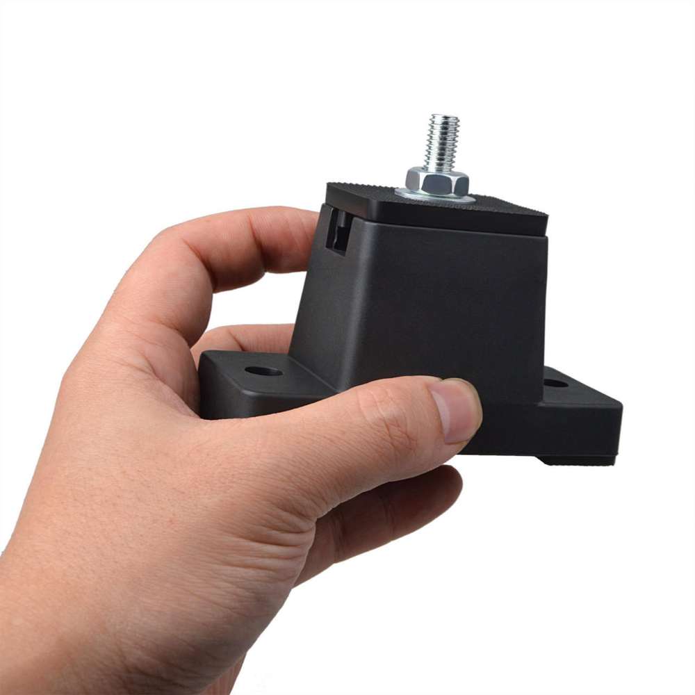 Hand holds Senville Rubber Pads for Mounting Mini Split AC Condenser, showing its compact size and sturdy rubber construction