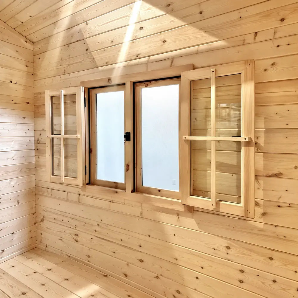 Wooden-framed double windows with frosted glass and open interior shutters inside the Harvest Grand Bungalow 107 garden room.
