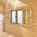 Wooden-framed double windows with frosted glass and open interior shutters inside the Harvest Grand Bungalow 107 garden room.